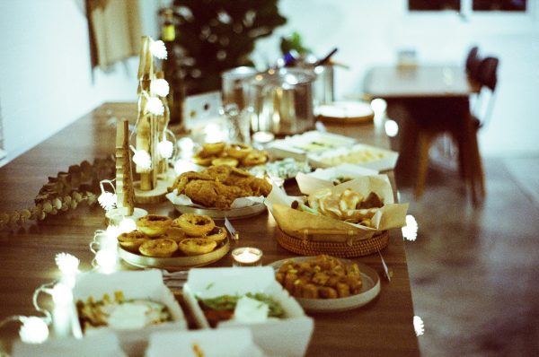 a wooden table topped with lots of food